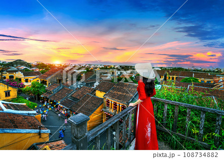 Tourist enjoying sunset on rooftop at Hoi an ancient town, Vietnam. 108734882