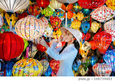 Asian woman wearing vietnam culture traditional and hoi an lanterns at Hoi An ancient town, Vietnam. 108734883