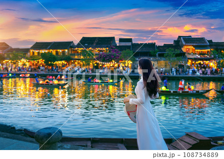 Asian woman wearing vietnam culture traditional at Hoi An ancient town,Hoi an city in Vietnam. Asian woman wearing vietnam culture traditional at Hoi An ancient town,Hoi an city in Vietnam. 108734889