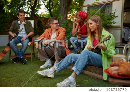 Summer party camping of diverse friends group with guitar music 108736779