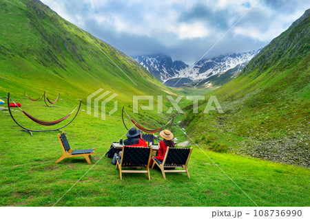 Tourist enjoy view of mountain valley landscape in Juta, Georgia. 108736990