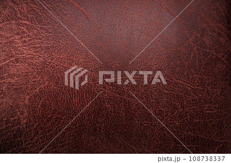 Old red leather cushion surface Old red leather cushion surface 108738337