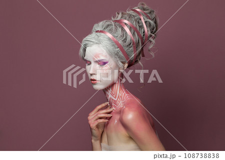 Stylish fashion model woman fantasy witch with stage makeup, studio portrait 108738838