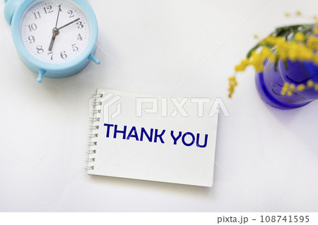 On a white background, a notepad with the word THANK YOU. retro style image 108741595