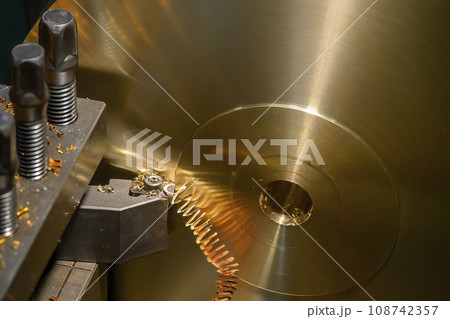 Closeup scene the lathe machine finish cut the brass parts by lathe tools. Closeup scene the lathe machine finish cut the brass parts by lathe tools. 108742357