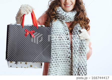 Trendy 40 years old woman in sweater, mittens, hat and scarf on 108744417