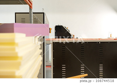 Stacked sheets of foam rubber for furniture production in factory workshop Stacked sheets of foam rubber for furniture production in factory workshop 108744518