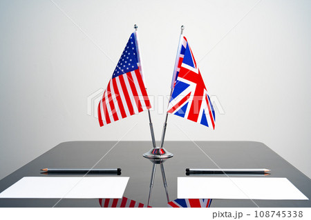 Flags of USA and United Kingdom on negotiation table 108745338