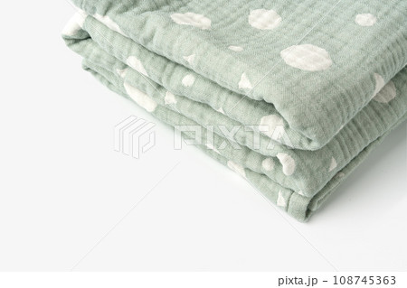 Green muslin blanket for kids on white background Green muslin blanket for kids on white background 108745363