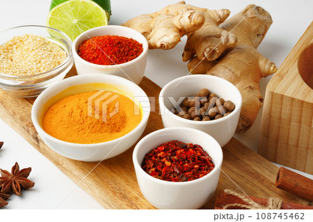 Ginger root and various spices on white background 108745462