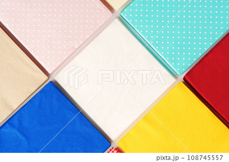 Colorful square paper napkins background top view Colorful square paper napkins background top view 108745557