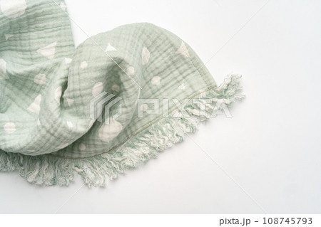 Green muslin blanket for kids on white background Green muslin blanket for kids on white background 108745793