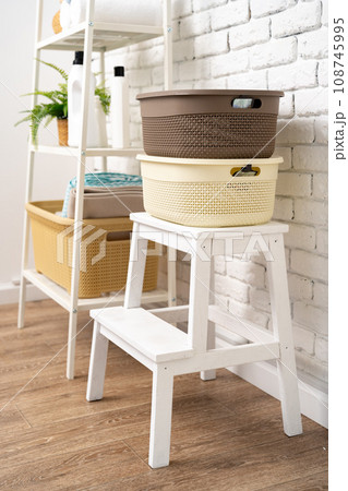 Plastic storage baskets in a bathroom interior 108745995