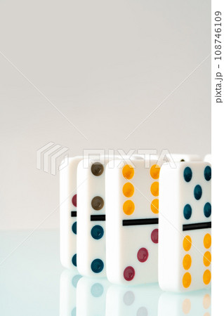Domino tiles in a row on white background Domino tiles in a row on white background 108746109