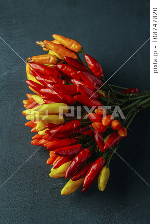 chili peppers of different colors 108747820