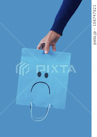 man with an empty sad shopping bag man with an empty sad shopping bag 108747821