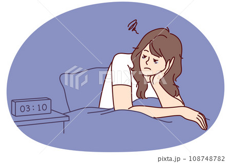 Exhausted woman sit in bed suffer from insomnia 108748782