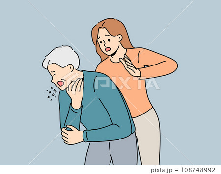 Woman performs heimlich maneuver for choking old man who needs help due to airway obstruction 108748992