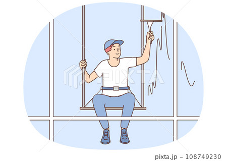 Man hanging on ropes clean building window 108749230