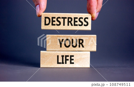 Destress your life symbol. Concept words Destress your life on wooden blocks. Doctor hand. Beautiful grey table grey background. Psychological business and destress your life concept. Copy space. 108749511