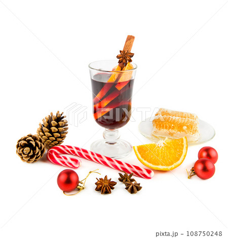 Mulled wine, spices and Christmas decorations isolated on white background. Mulled wine, spices and Christmas decorations isolated on white background. 108750248