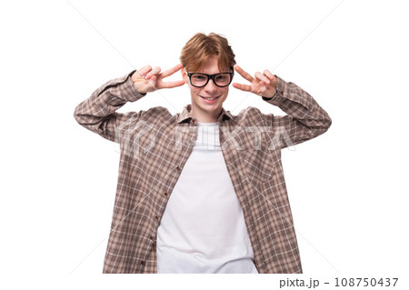 young charming student guy with red hair in glasses looks friendly young charming student guy with red hair in glasses looks friendly 108750437