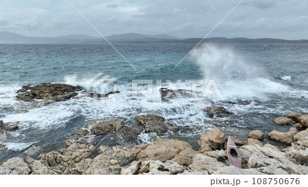 Aerial view of sea waves hitting the rocks with drone Aerial view of sea waves hitting the rocks with drone 108750676