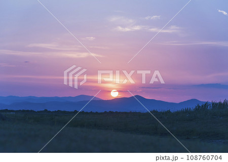 Violet purple sky in morning scenery Vibrant colorful blue sky summer time on sunrise. Natural beautiful landscape. Beauty purple sky romantic dramatic landscape cloudy outdoor paradise in sunset 108760704