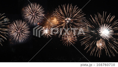 Golden Firework celebrate anniversary happy new year 2024, 4th of july holiday festival. Gold firework in the night time celebrate national holiday. Countdown to new year 2023 gold party time event 108760710