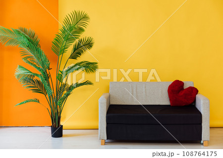 Yellow orange room interior with grey black office sofa at home 108764175