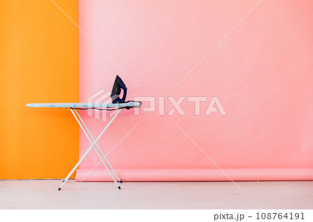 Room interior with ironing board and iron Room interior with ironing board and iron 108764191