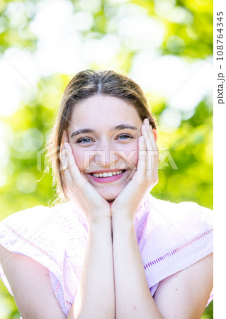 Joyful Radiance: Laughing Woman with Natural Beauty Joyful Radiance: Laughing Woman with Natural Beauty 108764345