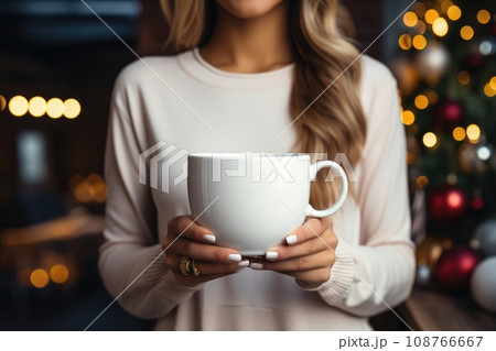 Empty blank mock up of white cup in woman hands 108766667