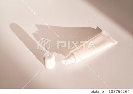 Hygienic moisturizing lip balm in a tube on a white background. 108769264