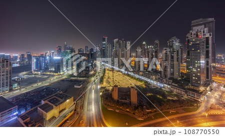 Bay Avenue with modern towers residential development in Business Bay aerial panoramic all night timelapse, Dubai 108770550
