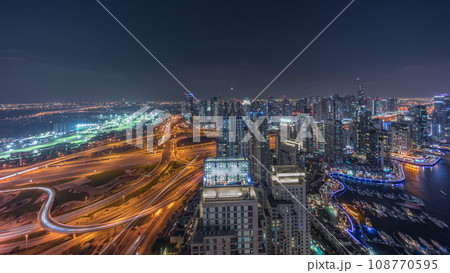 Dubai marina and JLT skyscrapers along Sheikh Zayed Road aerial day to night timelapse. 108770595
