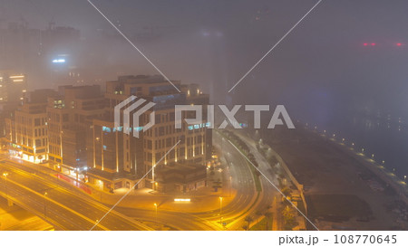 Skyscrapers at the Business Bay aerial all night timelapse in Dubai, United Arab Emirates Skyscrapers at the Business Bay aerial all night timelapse in Dubai, United Arab Emirates 108770645