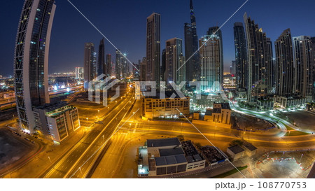 Aerial panorama of Dubai Downtown skyline with many towers night to day timelapse. Aerial panorama of Dubai Downtown skyline with many towers night to day timelapse. 108770753