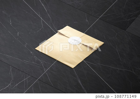 Blank craft square paper bag with sticker mockup Blank craft square paper bag with sticker mockup 108771149