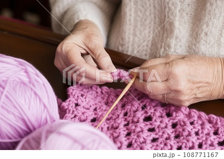 Hands of old woman in wrinkles crocheting ornament calming nerves with help of favorite hobby Hands of old woman in wrinkles crocheting ornament calming nerves with help of favorite hobby 108771167