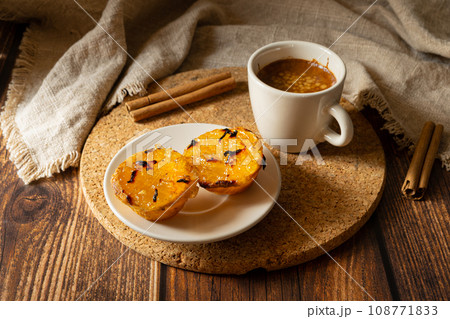 Typical Portuguese squash dessert with coffee Typical Portuguese squash dessert with coffee 108771833