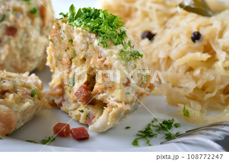 Homemade South Tyrolean bacon dumplings with sauerkraut 108772247