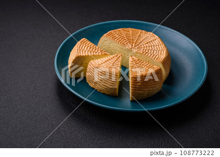 Delicious hard craft cheese made from cow or goat milk Delicious hard craft cheese made from cow or goat milk 108773222