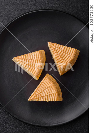 Delicious hard craft cheese made from cow or goat milk Delicious hard craft cheese made from cow or goat milk 108773230