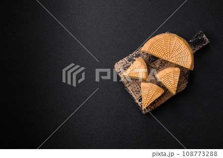 Delicious hard craft cheese made from cow or goat milk 108773288