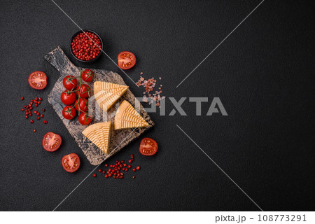 Delicious hard craft cheese made from cow or goat milk 108773291