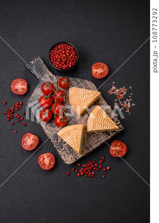 Delicious hard craft cheese made from cow or goat milk 108773292
