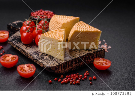 Delicious hard craft cheese made from cow or goat milk 108773293