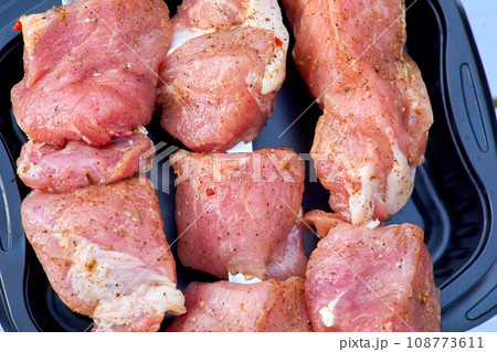 Pieces of fresh raw meat for barbecue, grilling on skewers 108773611
