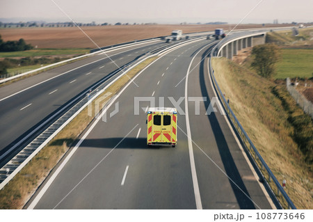 Ambulance car of emergency medical service on highway. 108773646